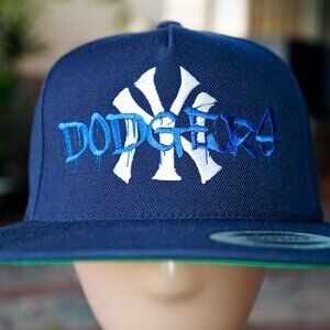 Los Angeles LA Dodgers Graffiti Over New York NY Yankees World Series Hat